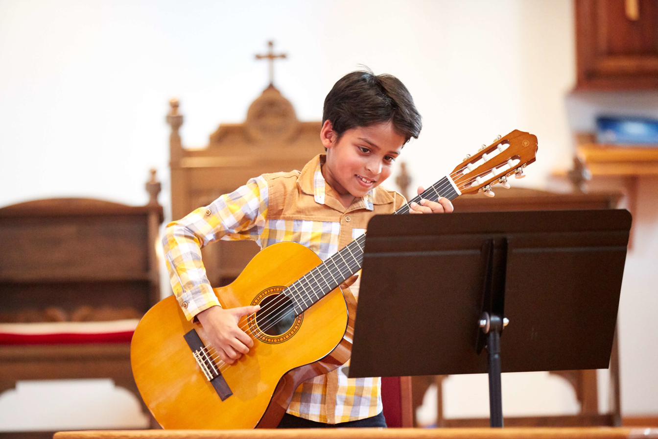 Student performing at CSM guitar recital