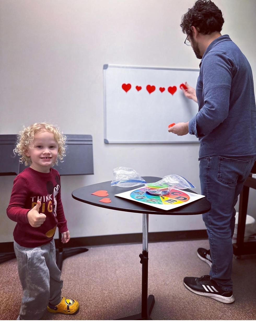 Young student giving thumbs up during Music Discovery lesson at CSM
