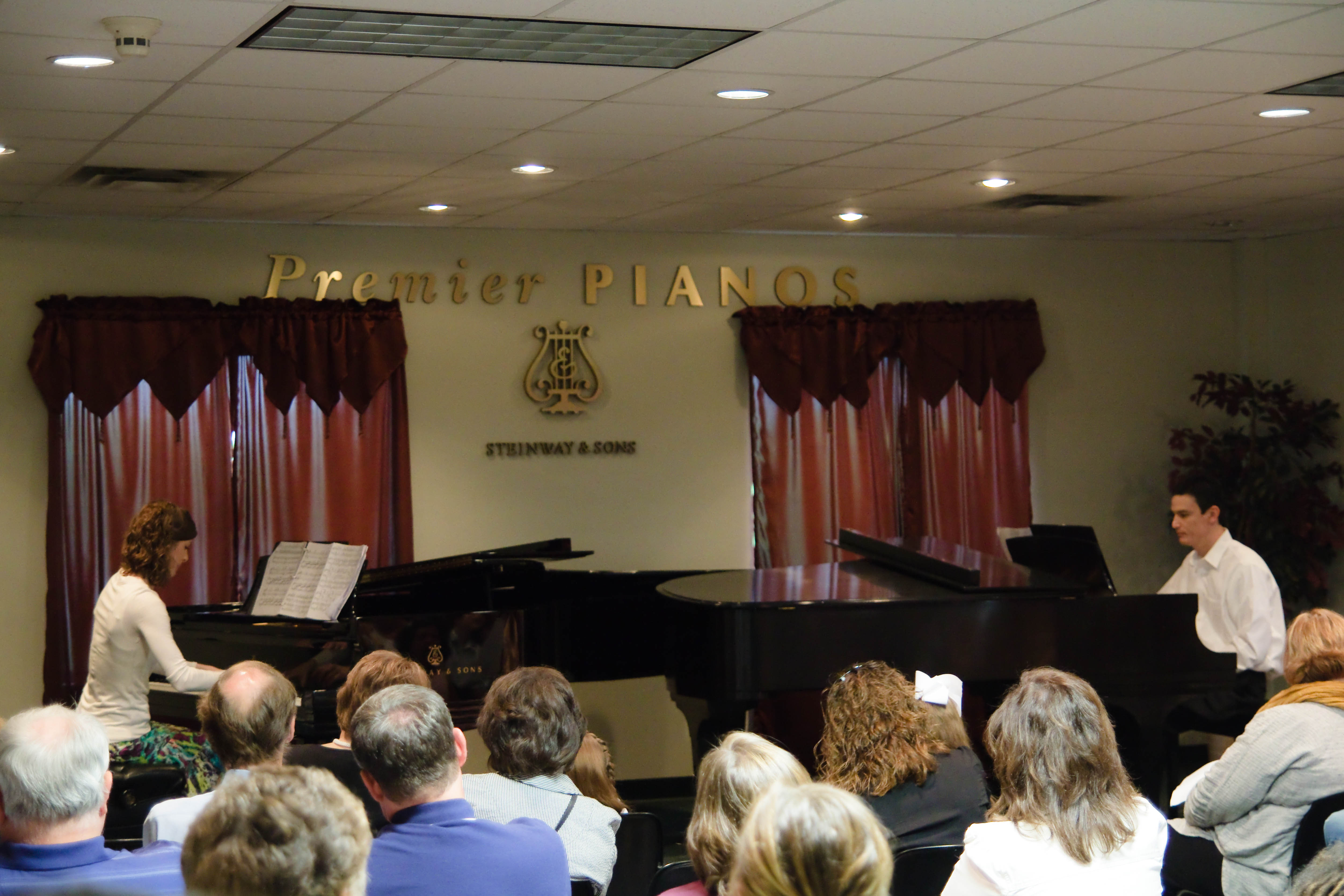 Joe and Anna Backer performing a Rachmaninoff piece at the final Backer Piano Studio recital, Premier Pianos