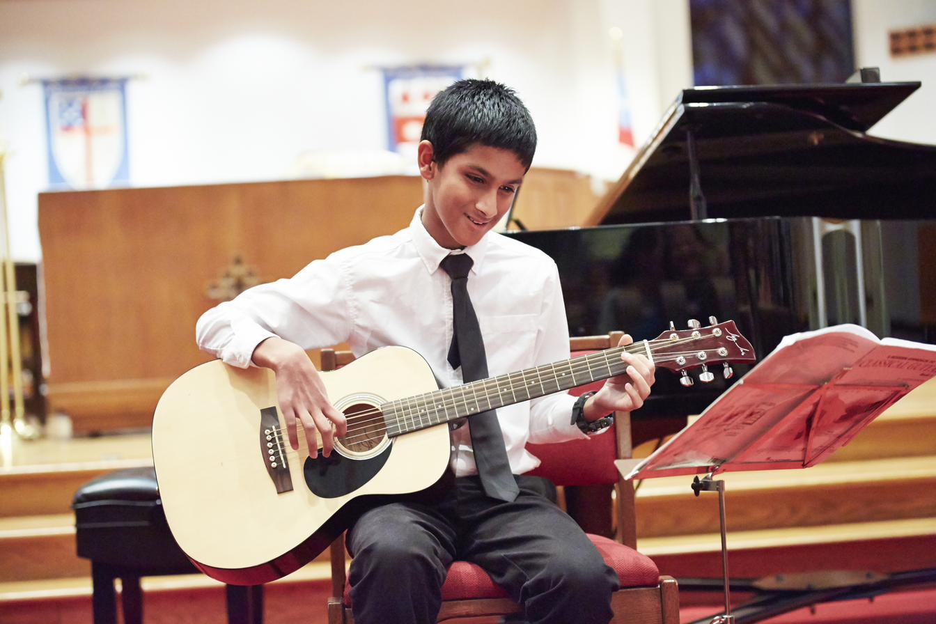 Guitar student performing at CSM recital