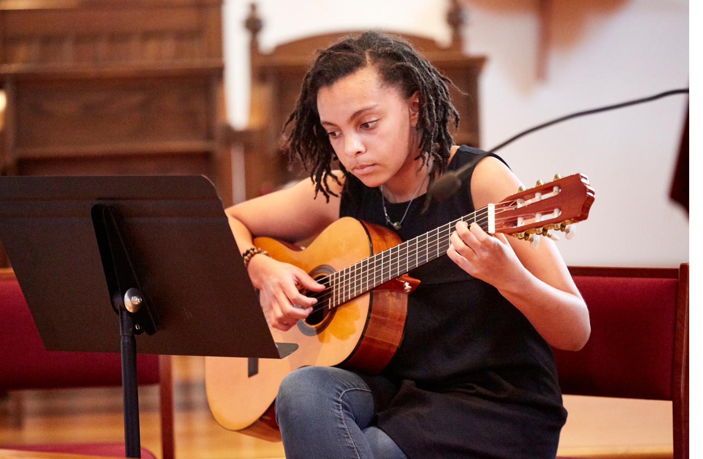 Student performing at CSM guitar recital