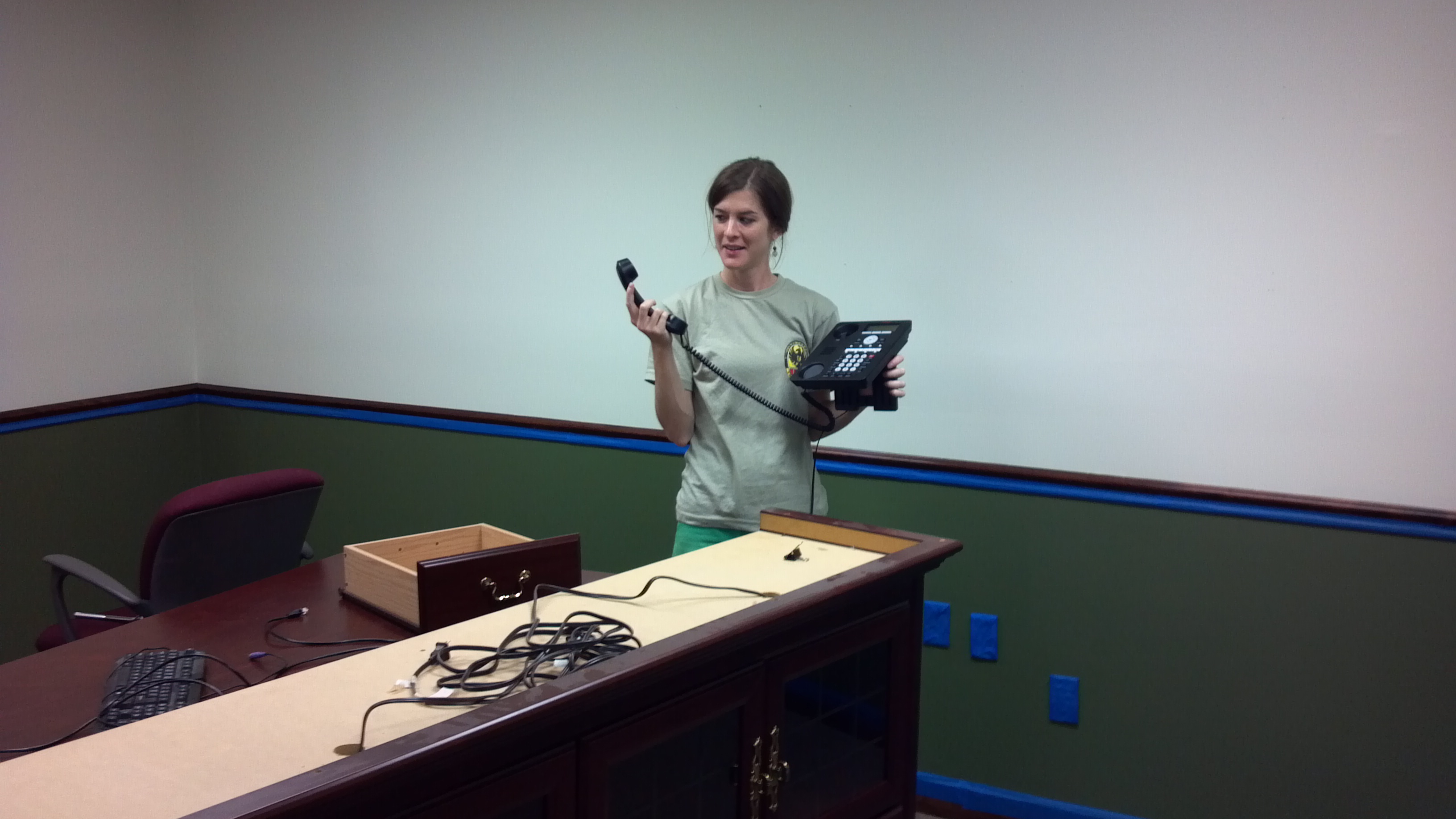 Anna Backer setting up the front desk phone in the first CSM space, summer 2012