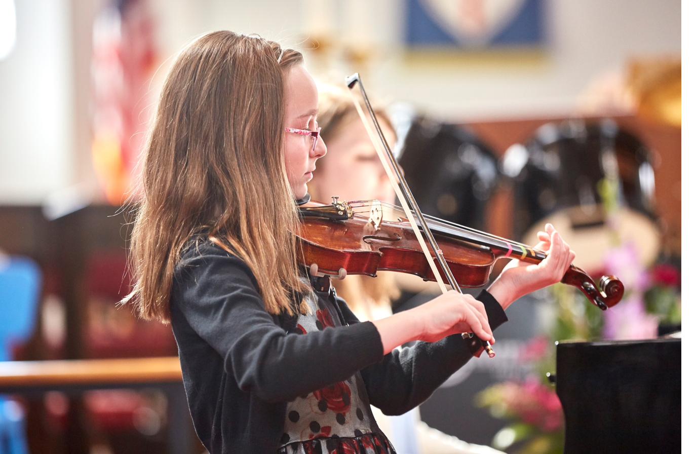 Violin student performing at CSM recital